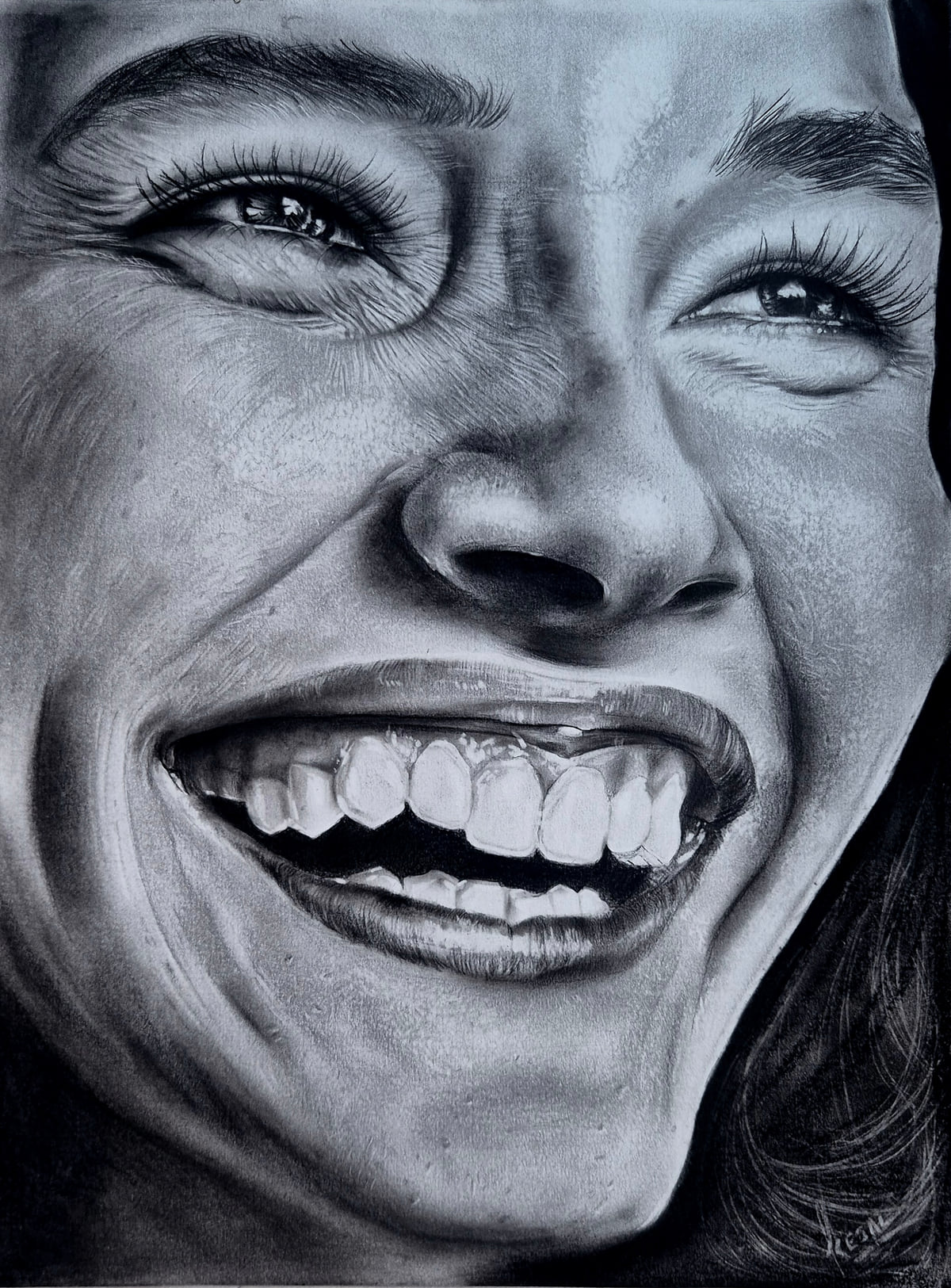 Close-up charcoal portrait of a woman laughing, her eyes crinkled and teeth showing