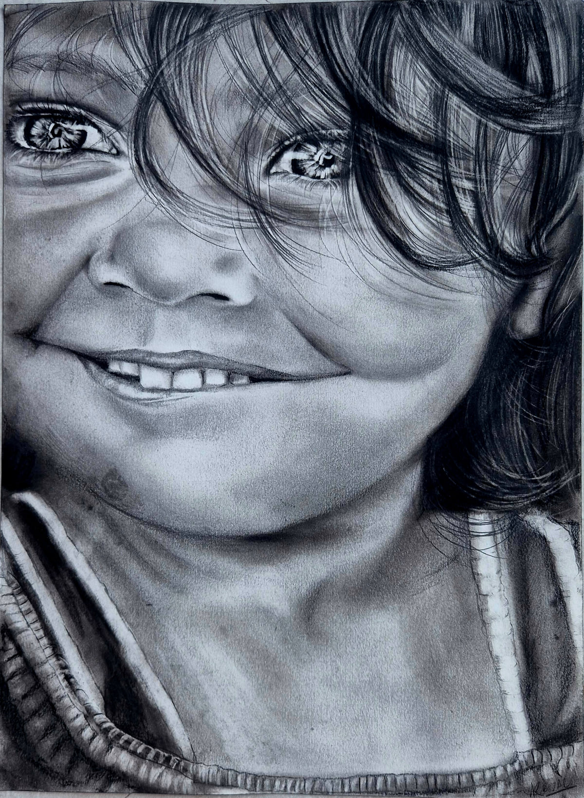 Charcoal and graphite portrait of a smiling young child with messy hair and bright eyes